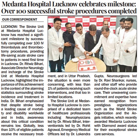 Medanta Hospital Lucknow team cutting a cake to mark 100 successful stroke procedures