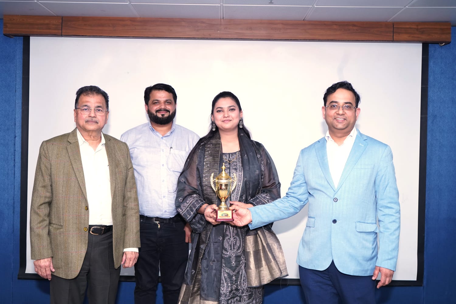 Trophy presentation to EEG Grand Quiz winner
