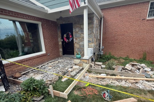 A porch demolition in progress, cleared and staged for new work