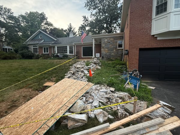 Old flagstone walkway demolished and debris cleared for haul-away