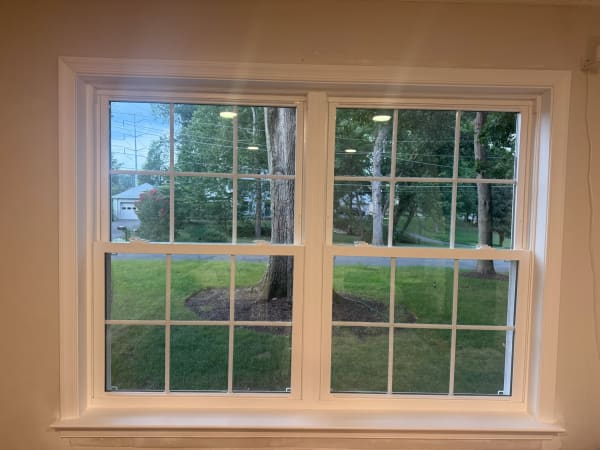 New double-hung windows with fresh interior trim