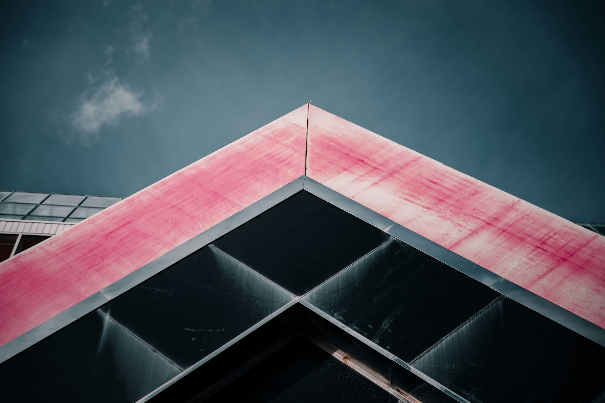 A dark, dramatic sky over black panels