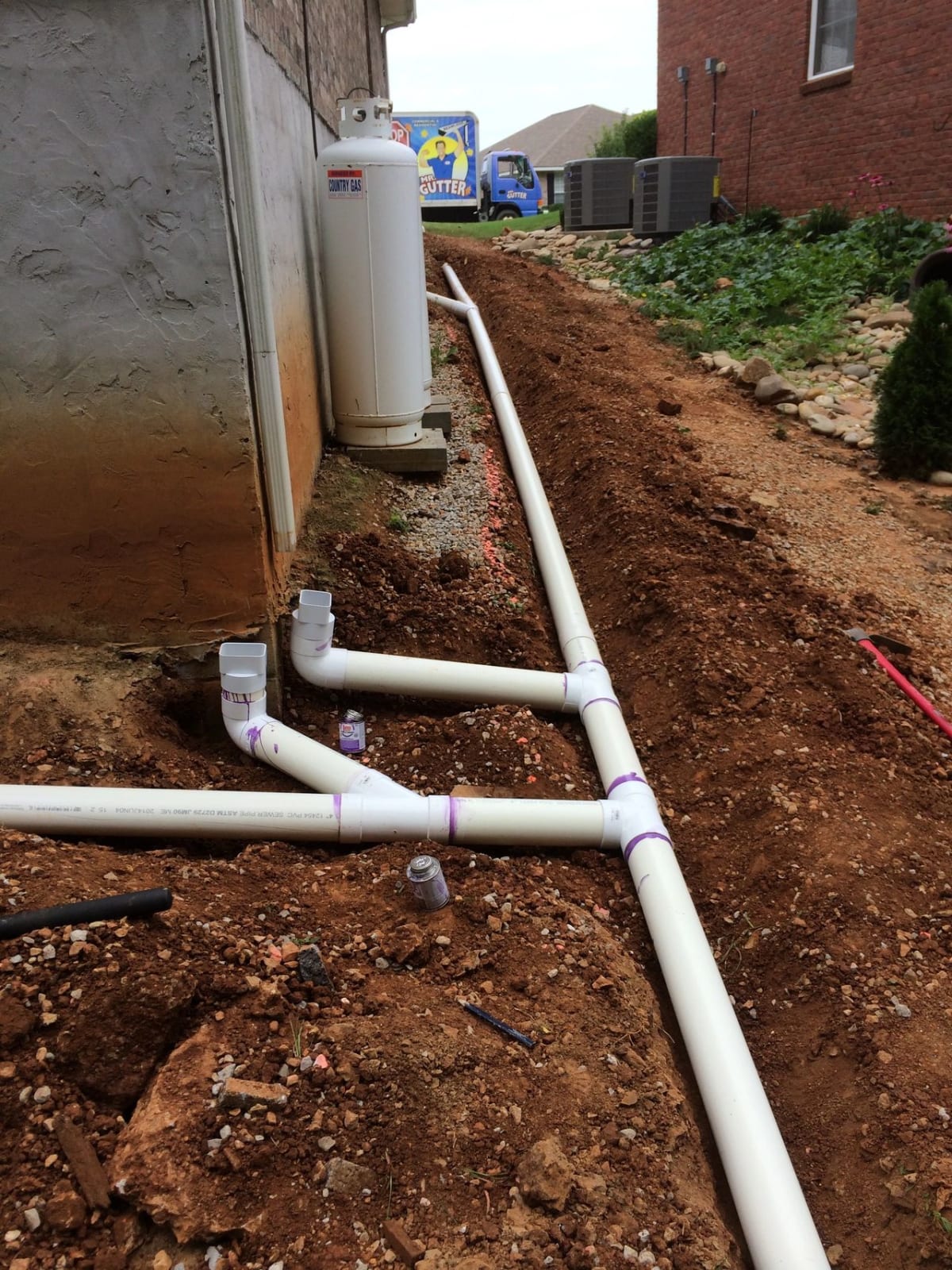 MR GUTTER installing Drains