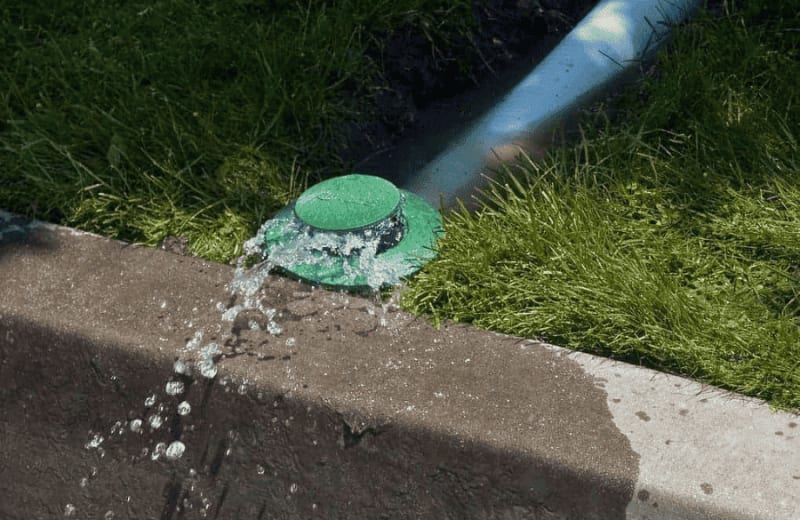 Underground drain discharge with pop-up emitter