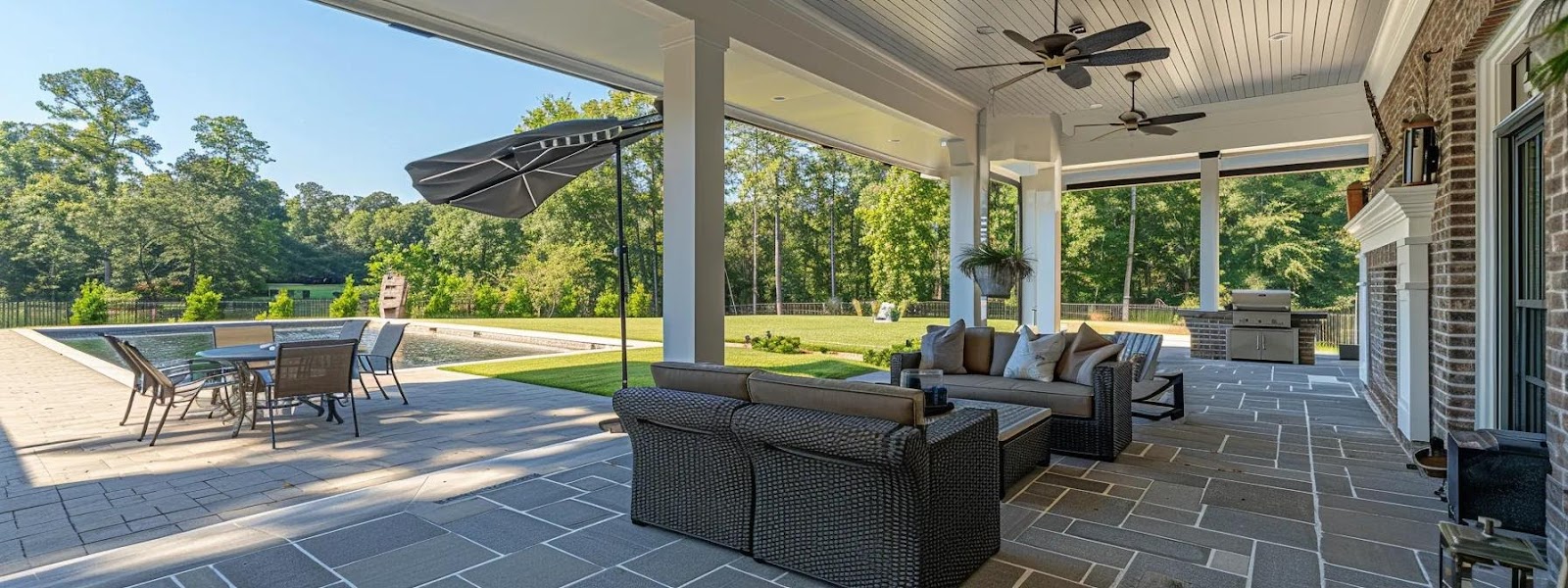 a sleek, modern patio setup during a vibrant alabama afternoon features strategically positioned outdoor fans and stylish shaded furniture, creating an inviting space that symbolizes optimized airflow and comfort in the midst of a heat wave.