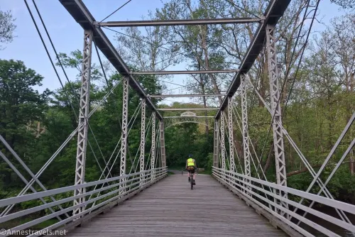 A cyclist on the historic bridge near Breckville Station along the C&O Canal Path, Cuyahoga Valley National Park, Ohio