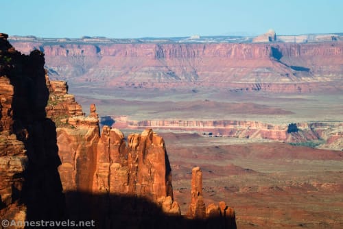Yellow rock formations in front of canyon and red cliff views