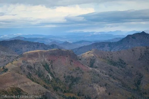 Views to the northwest - there are so many mountains out there, very likely including Mt. Washburn and peaks near Beartooth Pass.  Avalanche Peak, Yellowstone National Park, Wyoming