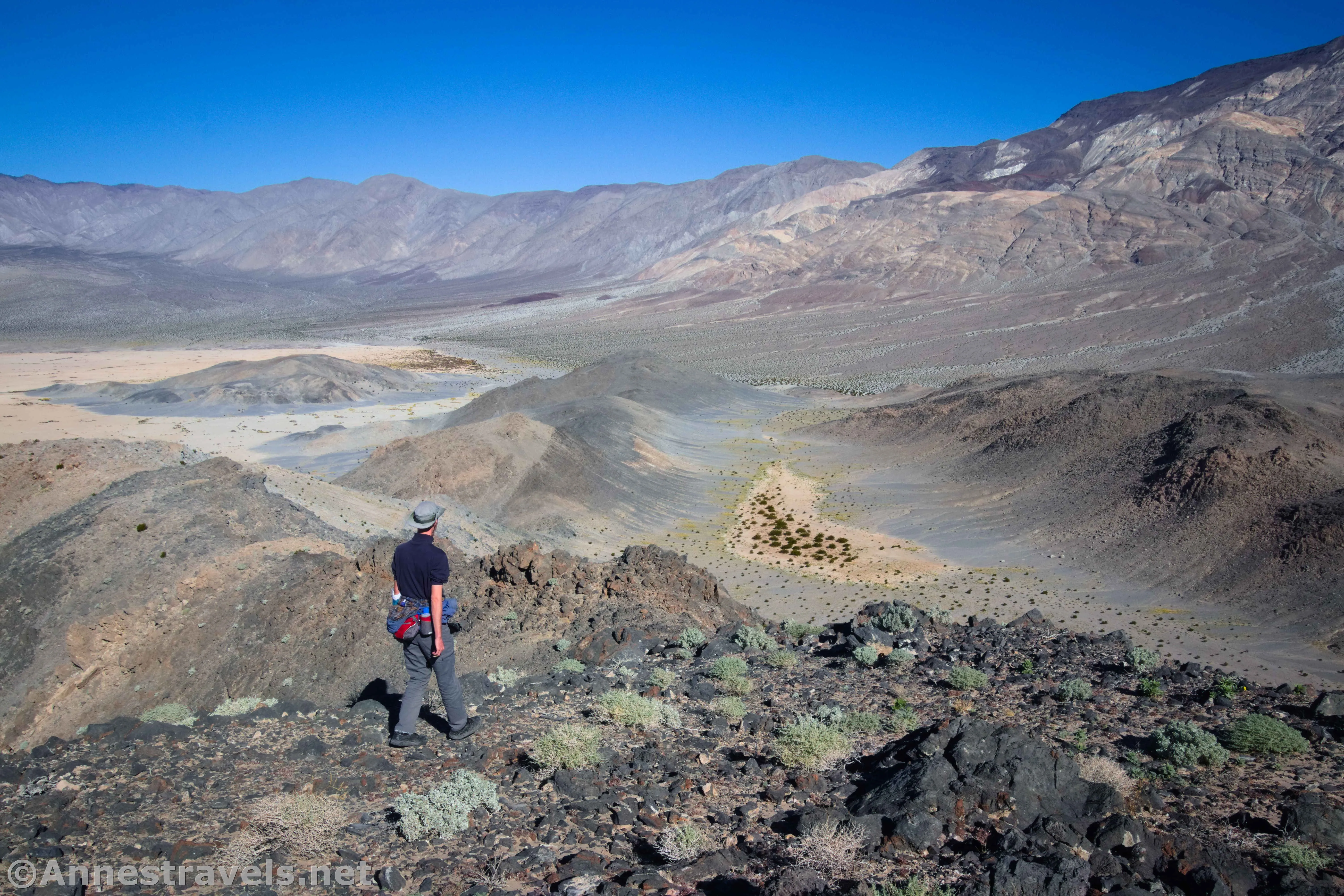 Hiking down Lake Hill.  We'll go down to the pass (just above the hiker's hat) and then scramble down to the small patch of playa on the right.  Death Valley National Park, California