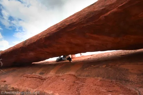 My group member pointing his GoPro through Slanted-Eye Arch. Arches National Park, Utah