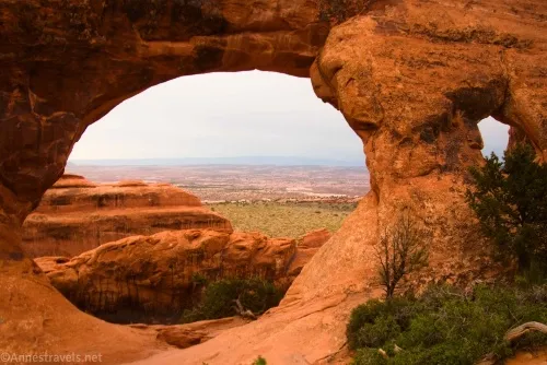 The view through Partition Arch in Devils Garden, Arches National Park, Utah
