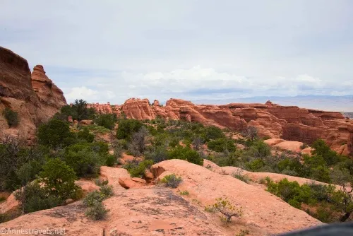 Hiking along a rock shelf north of Devils Garden, Arches National Park, Utah