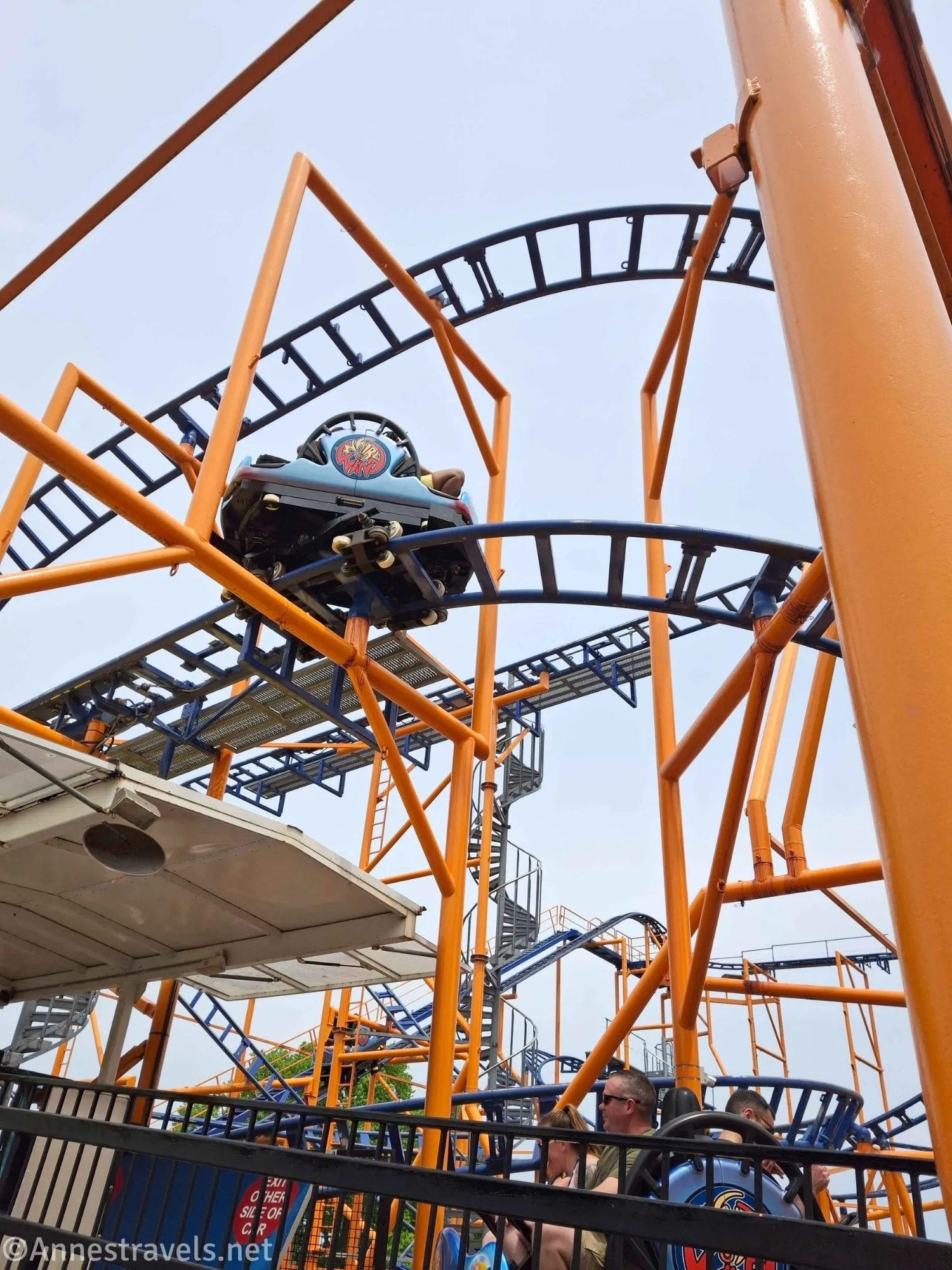 Standing below the Whirlwind at SeaBreeze Amusement Park, New York