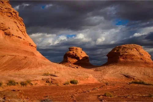 Yellow and red rock formations beneath threatening skies