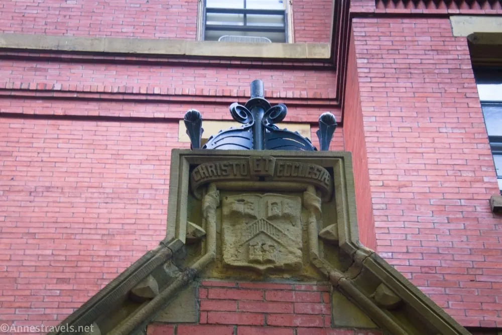 A carved relief at Harvard on a brick building