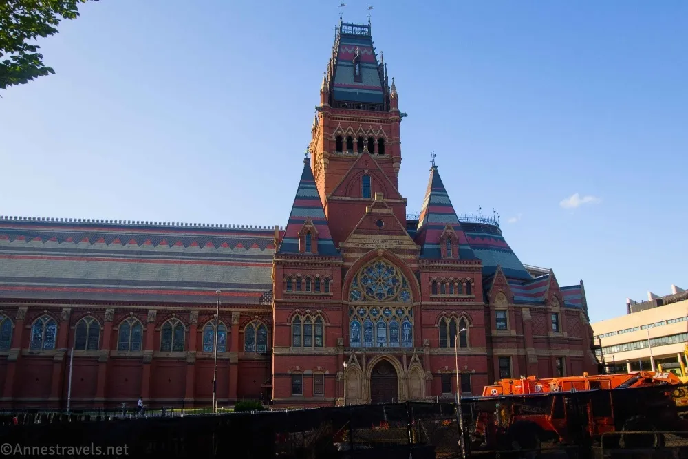 An ornate brick building with stained-glass windows and several towers