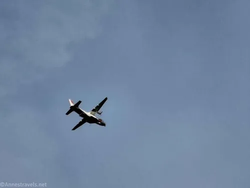 An airplane in a cloudy sky 