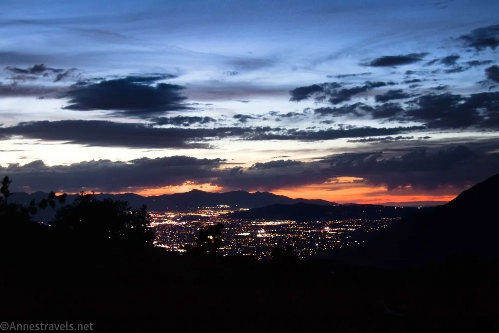 Sunset and clouds above a city full of lights 