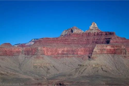 Grand Canyon cliffs with a white spire on top