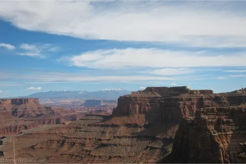 Desert cliffs and mountains over a canyon