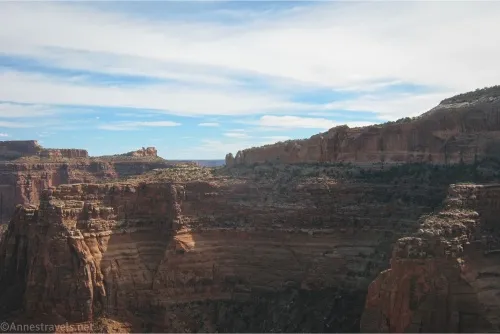 Desert cliffs below cloudy skies