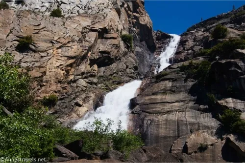 A waterfall tumbles down a rocky cliff
