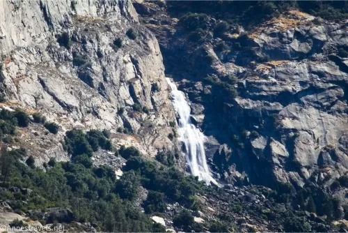 A waterfall tumbles down a rocky cliff