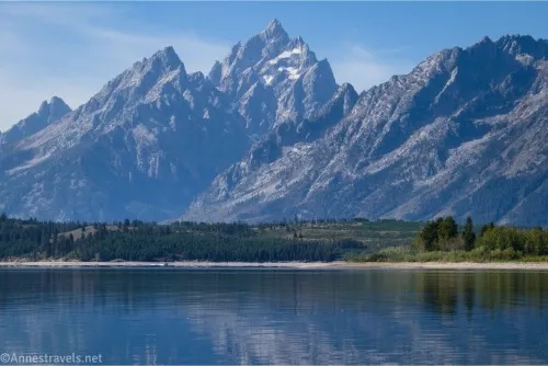 Towering, craggy peaks above a quiet lake 