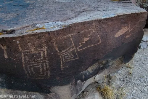 Geometric rock art on a boulder 