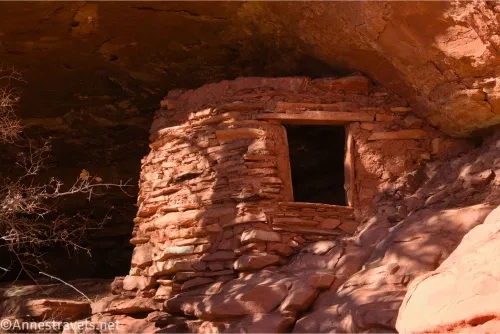 A rock granary with a wooden window in a desert alcove