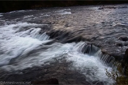 A small waterfall in a broad river