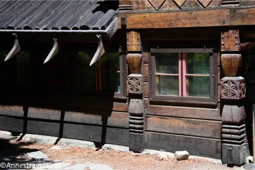 Carved wood and windows in the side of a house