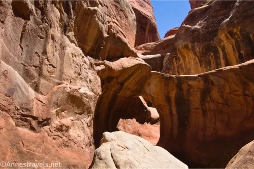 A rock canyon with a hole of an arch