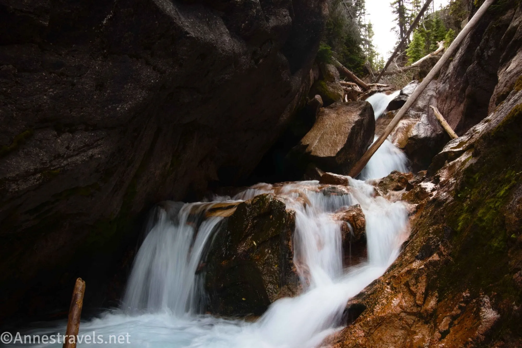 A divided waterfall in a narrow canyon 
