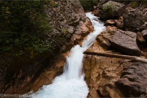 A narrow stream of water tumbles between rocks