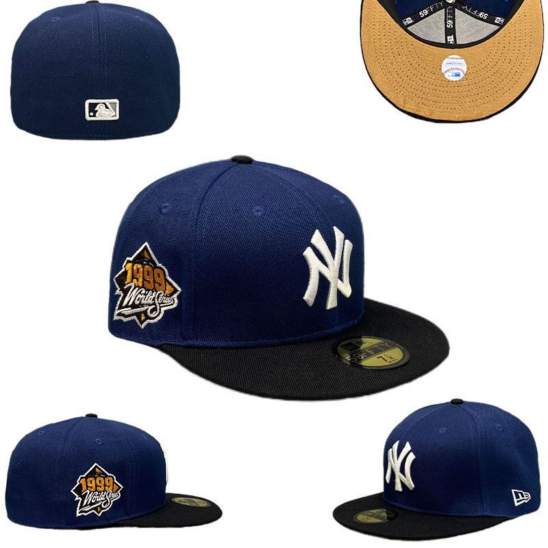 New Era New York Yankees World Series 59Fifty fitted hat in navy with a black brim and a tan undervisor.