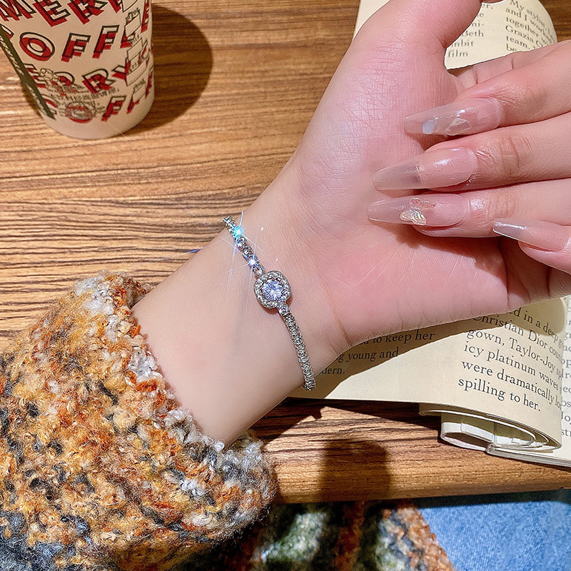 Non-Tarnish Bracelet - silver-plated charm bracelet featuring a central round-cut gem