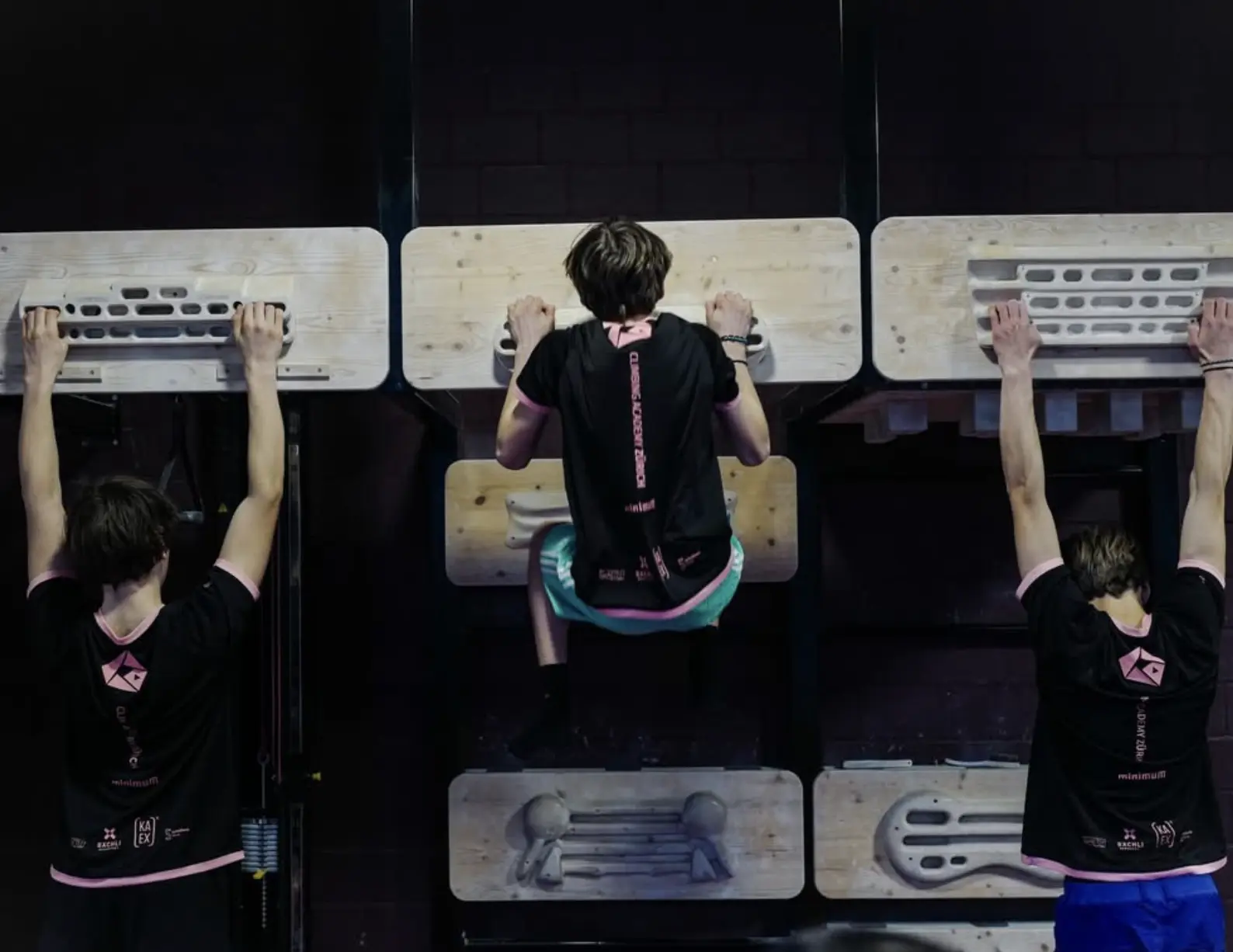 Climbing Academy Zürich athletes on training board showing competition kit back detailing