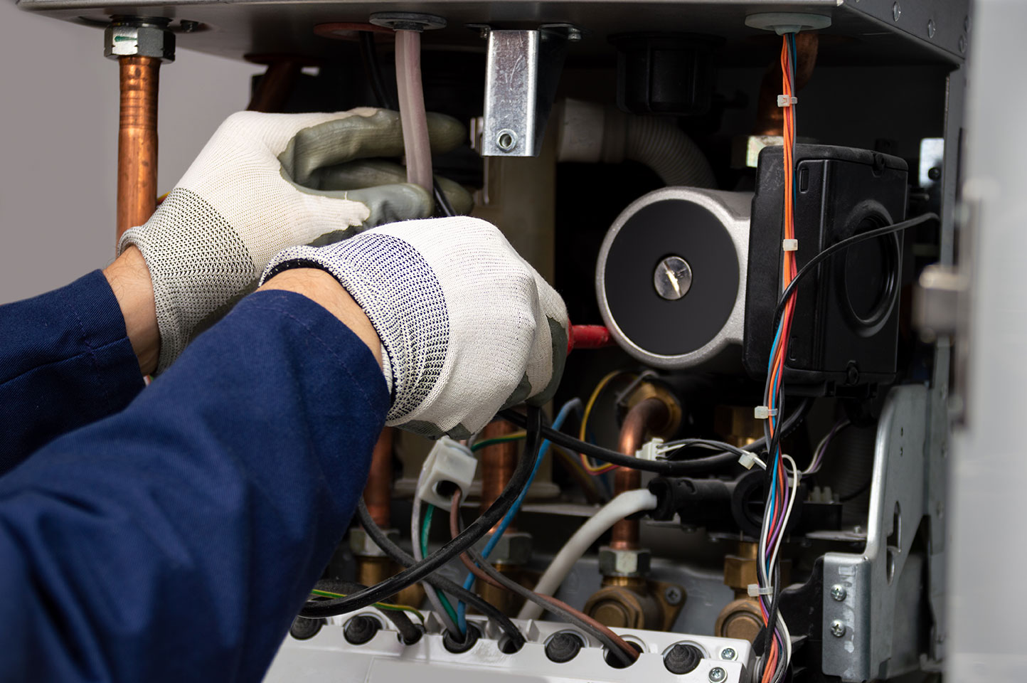 Technician working on a boiler