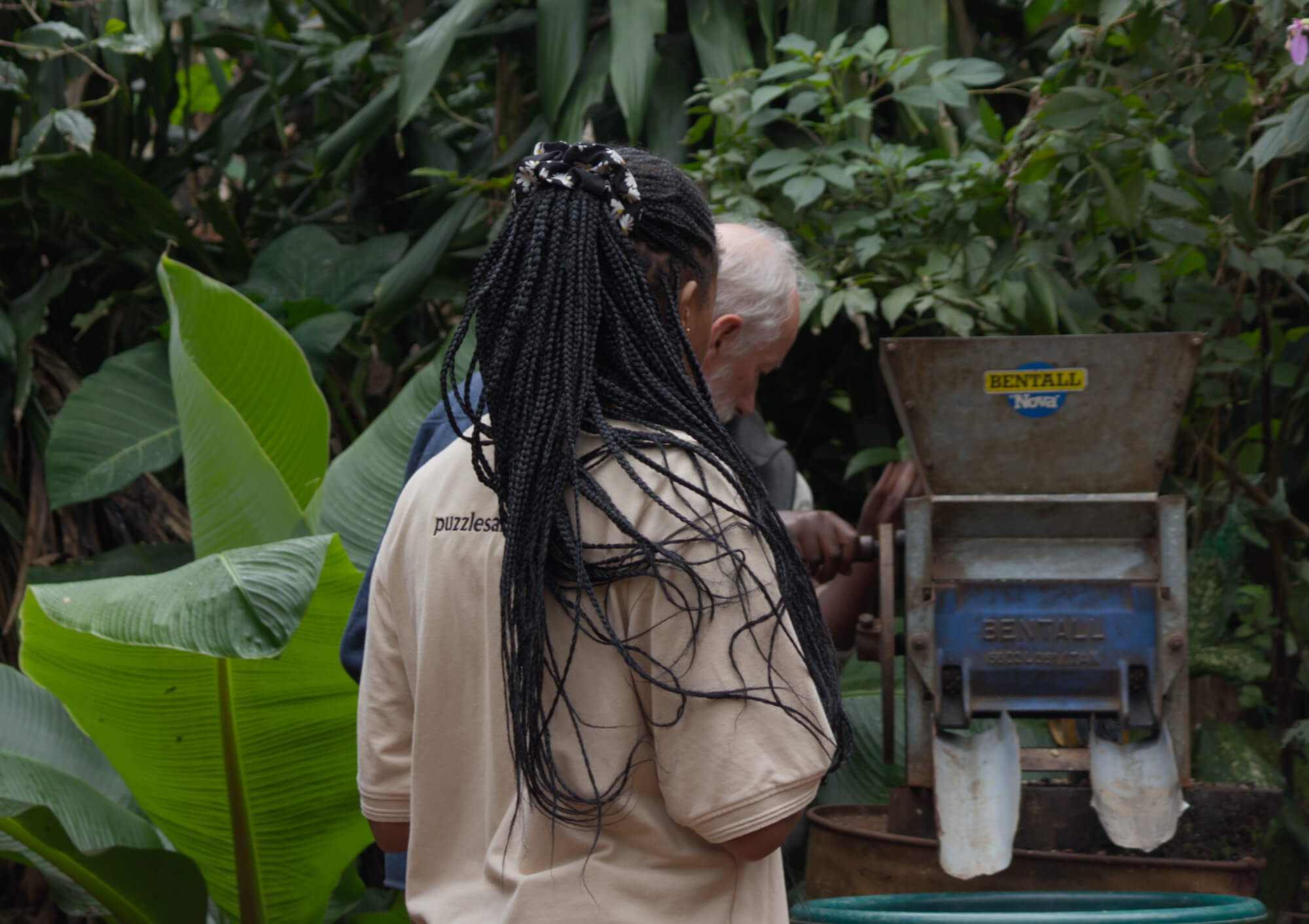 Two people looking at a coffee machine