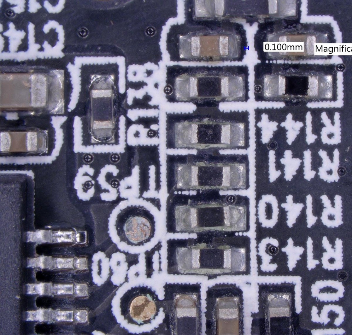 Optical micrograph of corroded surface-mount resistors at 50 times magnification