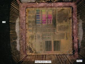 Ball bond still on pads on the die, note the area in red ellipse. 