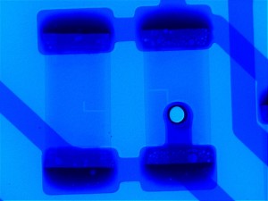 Micrograph of R1 and R2 on a good PCB, bubbles are voiding