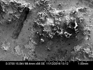 Micrograph of corrosion on oscillator housing