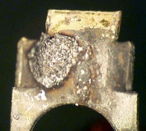 Tab with corrosion