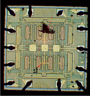 failed die, arrows point to damaged spots