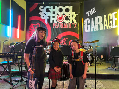 Band with instructor at School of Rock