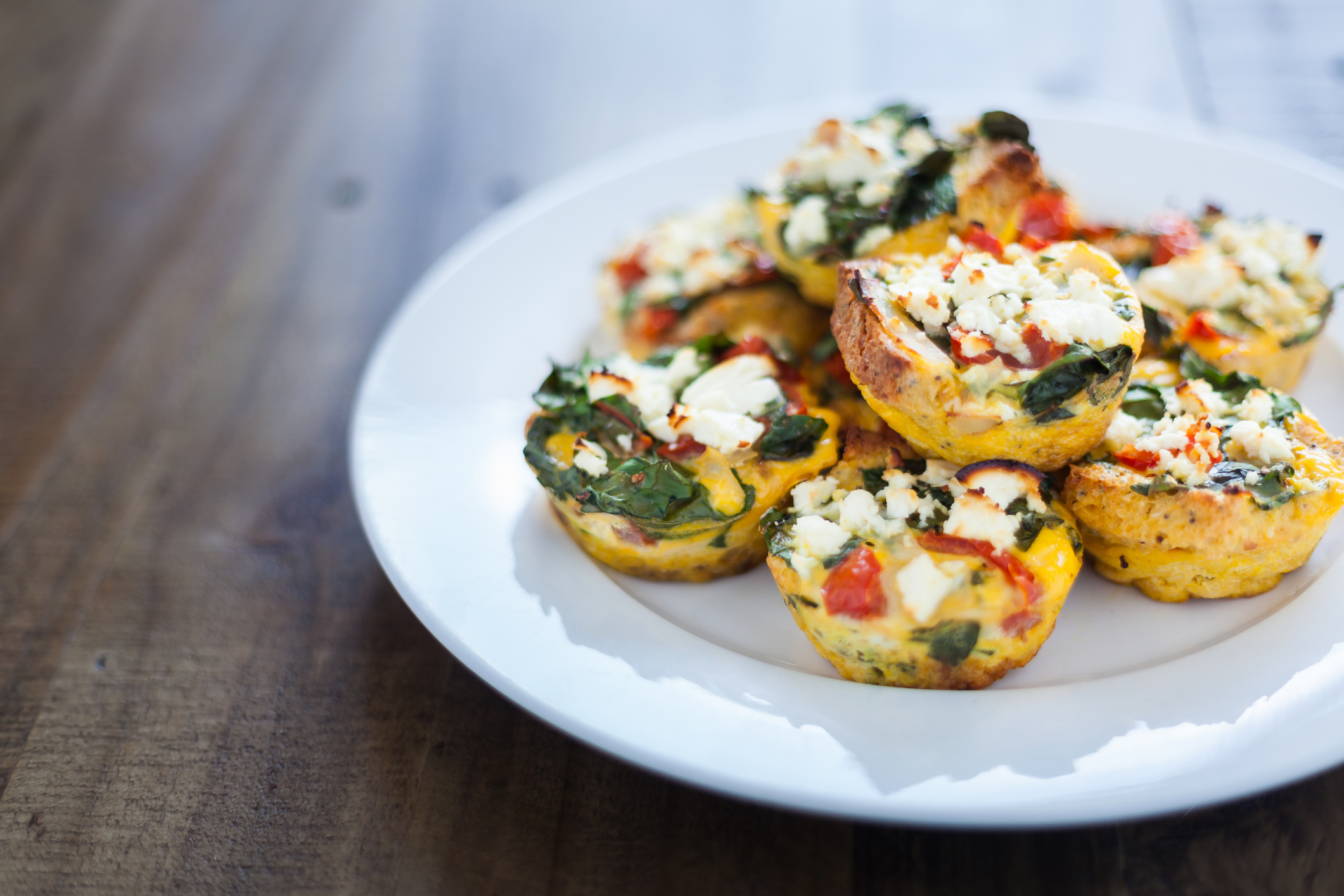 Home made chicken and egg muffins, with spinach, capsicum and feta cheese