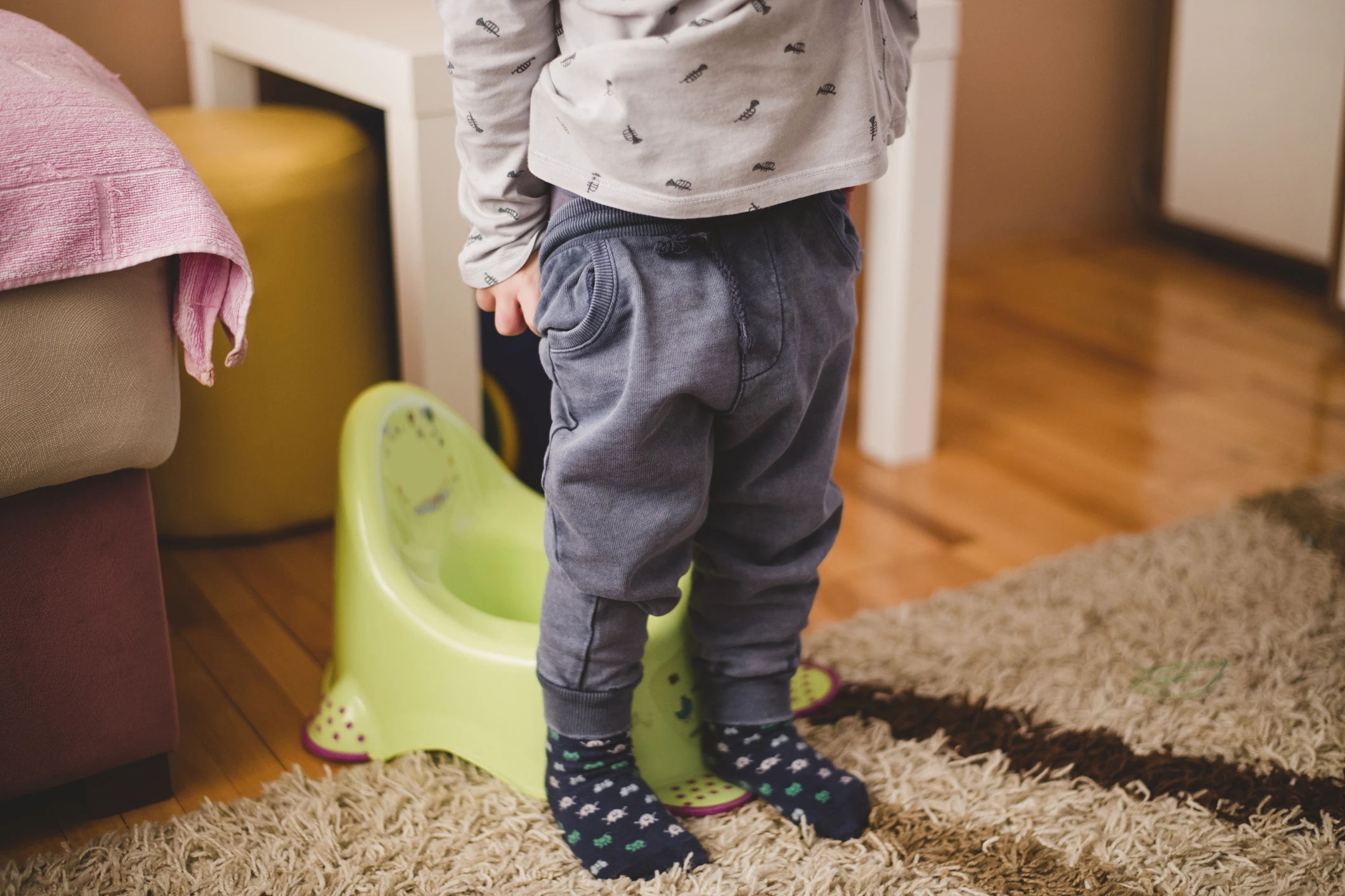 Child preparing to sit on the potty