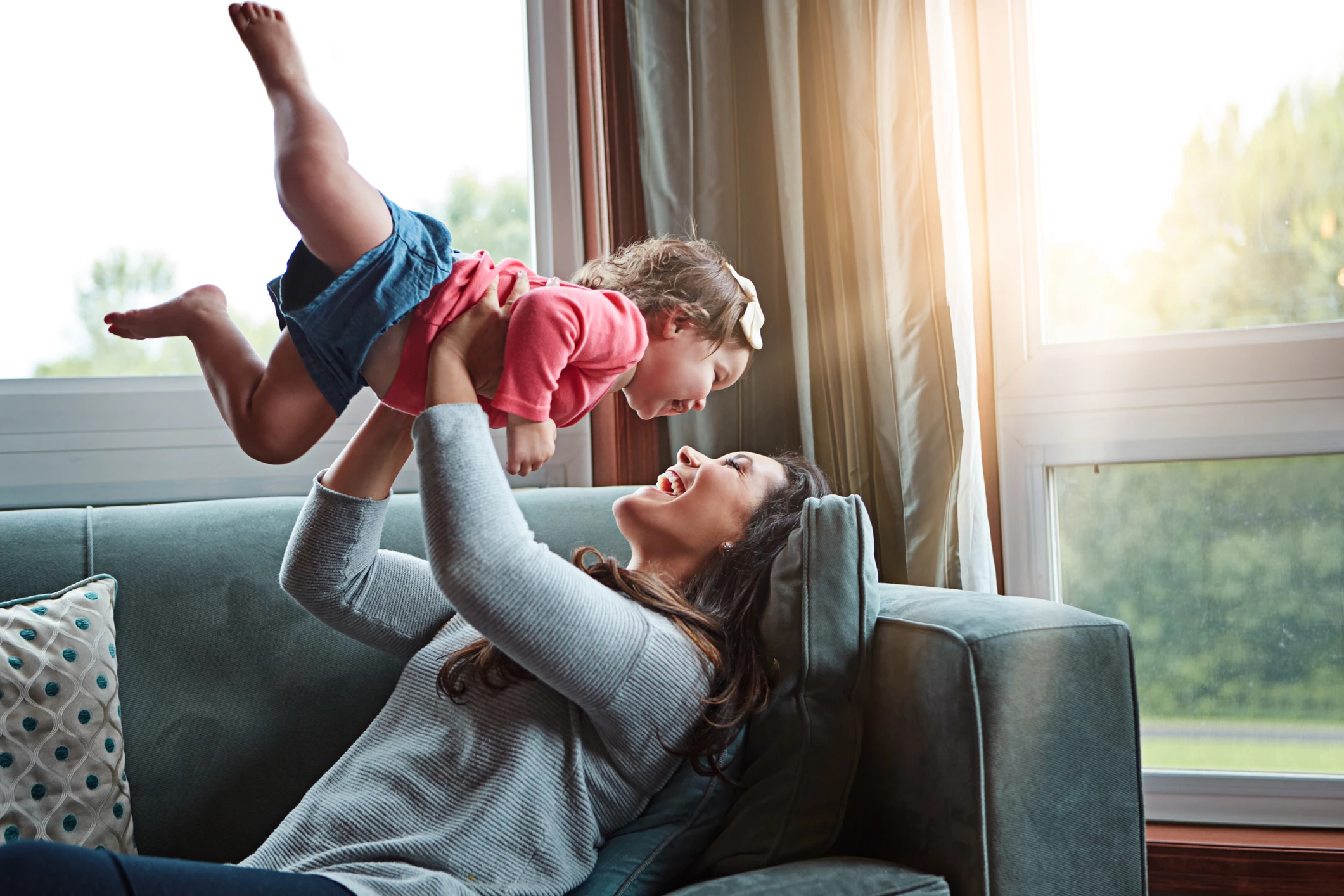 Shot of a mother bonding with her adorable little daughter at home